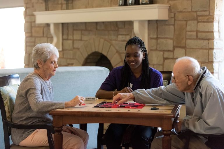 Staff and residents playing checkers