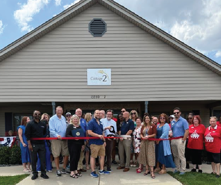 Artboard 1ribbon Ribbon Cutting ceremony at the cottage at The Courtyar at Sherling Heights