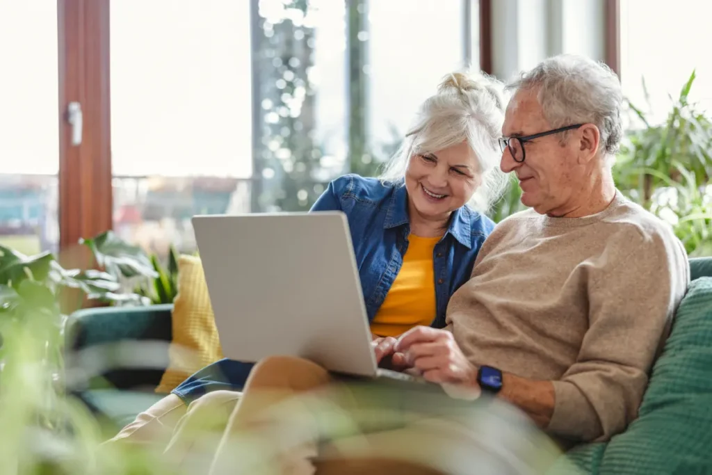 Senior couple looking at laptop