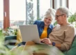 Senior couple looking at laptop