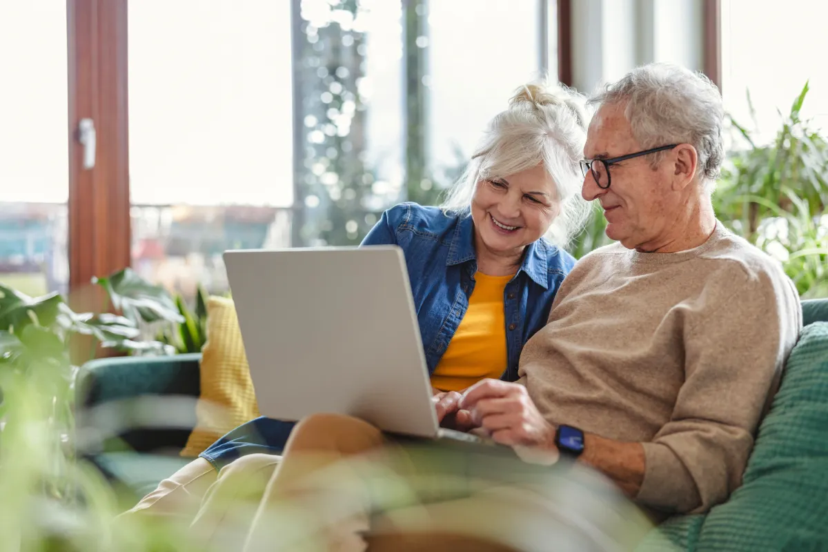 Senior couple looking at laptop Senior couple looking at laptop