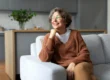 Senior woman sitting in assisted living apartment