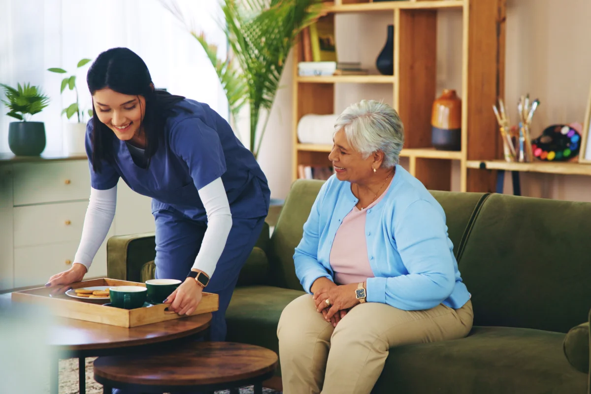 Team member helping resident with daily activities Team member helping resident with daily activities